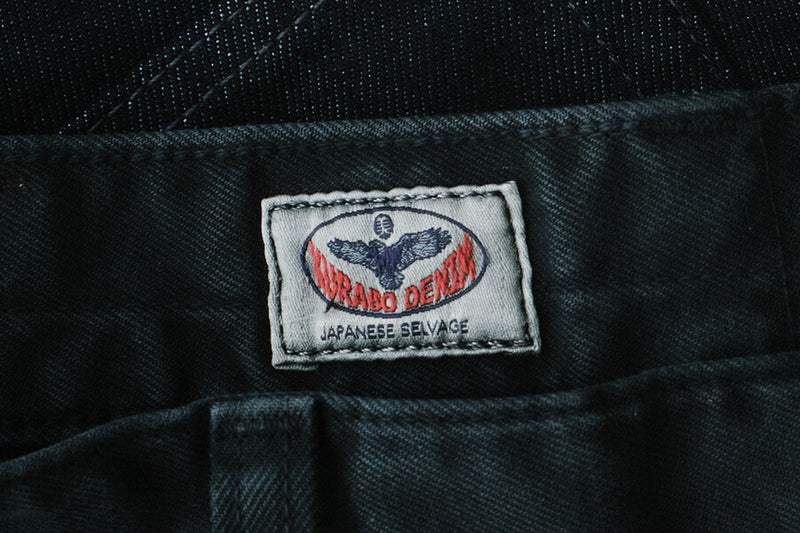 Close-up of a label on a dark fabric background