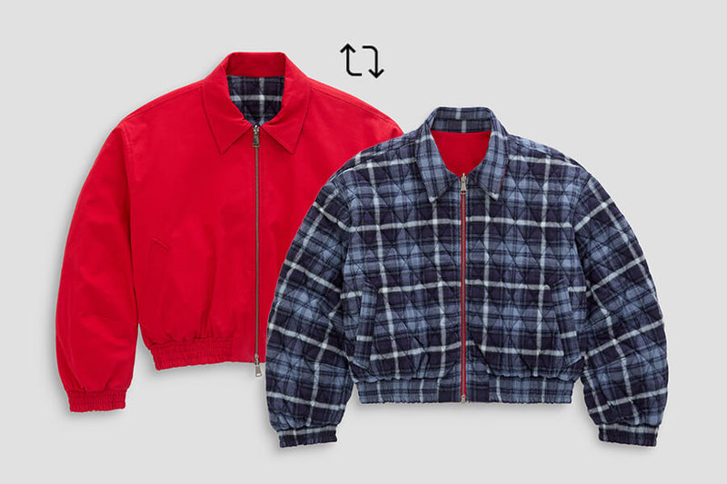 Two cropped zip-front jackets shown on a light gray background: one solid bright red jacket and one navy/blue plaid jacket with a red inner lining. No person, animal, or real environment is present.