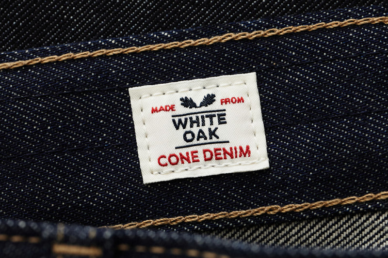 Denim fabric with a label reading 'Made from White Oak Cone Denim'.