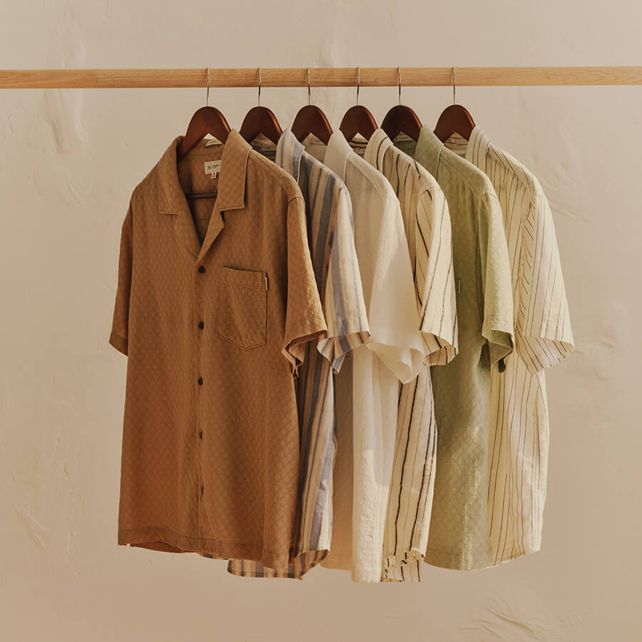 Wall of hanging linen shirts