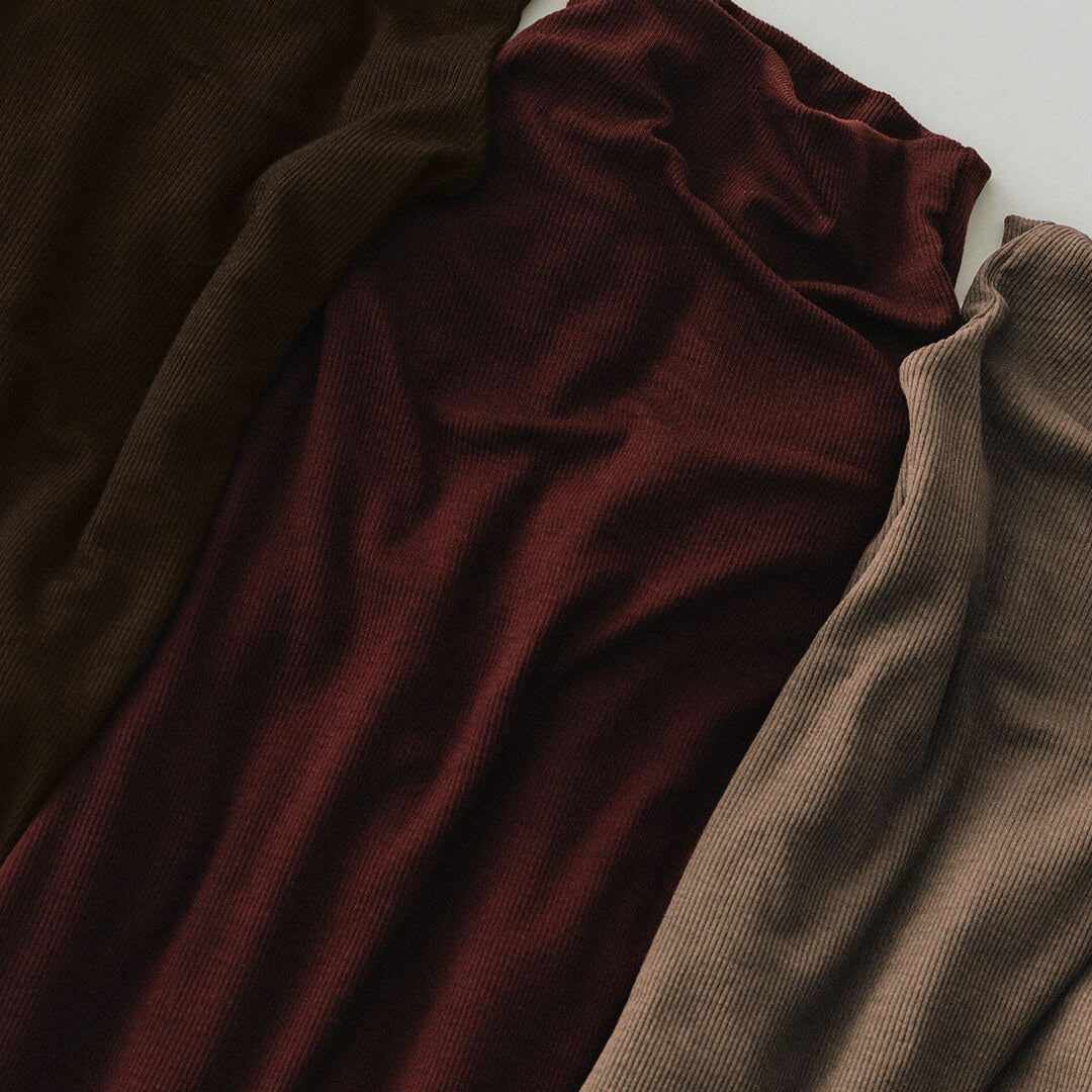 Close-up of brown fabric with a focus on texture and color gradient.