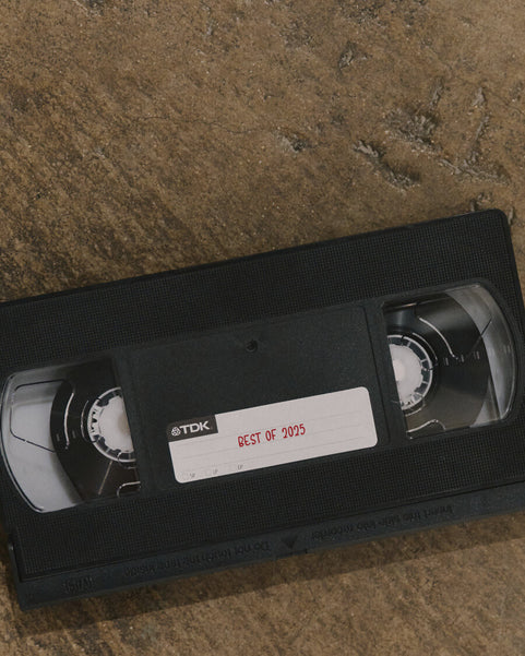 VHS tape with 'Best of 2025' label on a textured surface