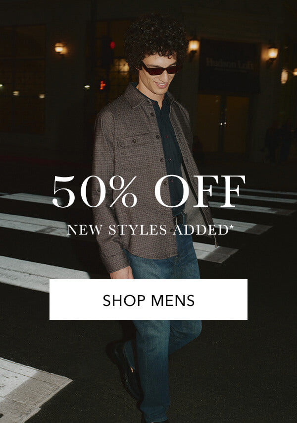 Man walking on a street at night with promotional text overlay