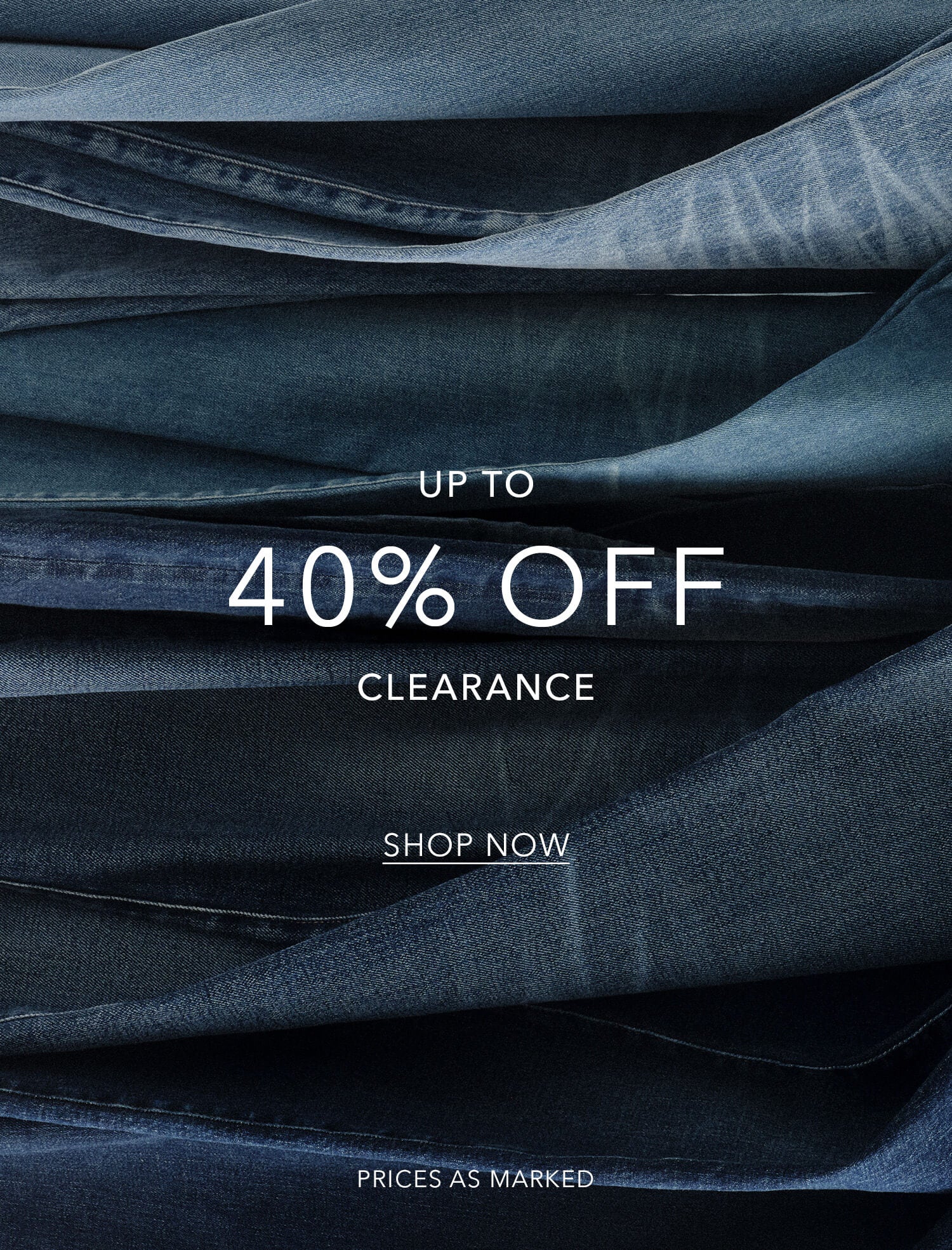 Stack of blue jeans with clearance sale text overlay