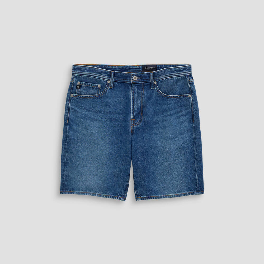 Blue denim shorts on a light gray background