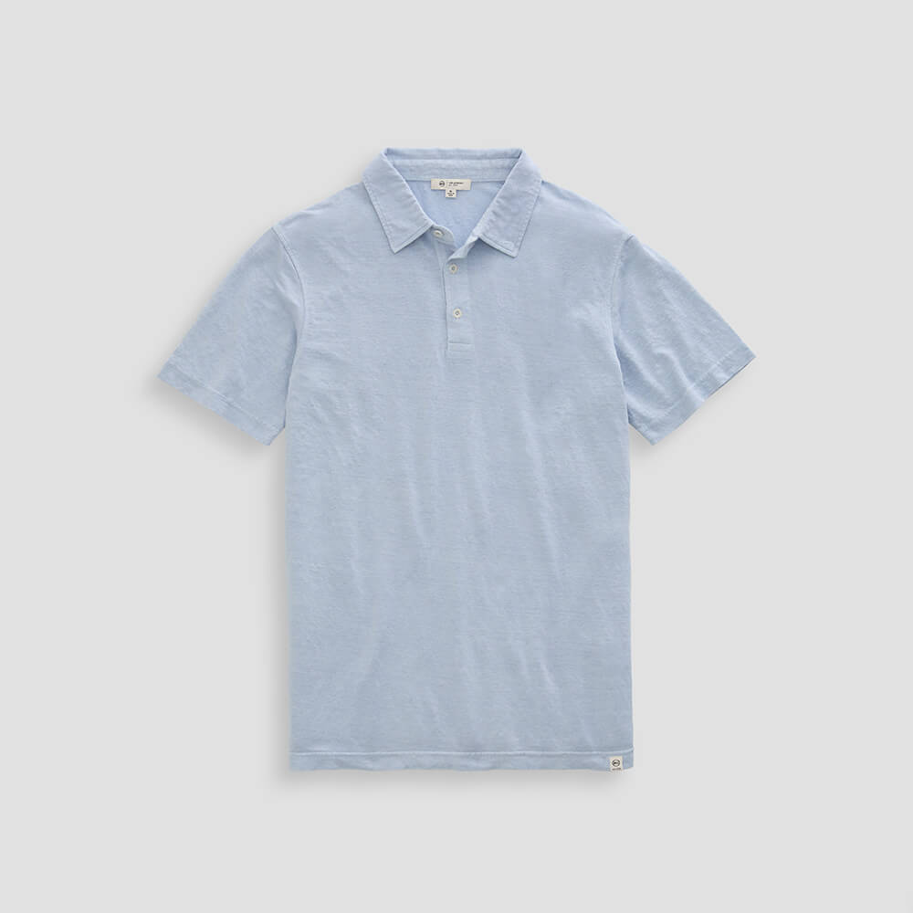 Light blue polo shirt on a light gray background
