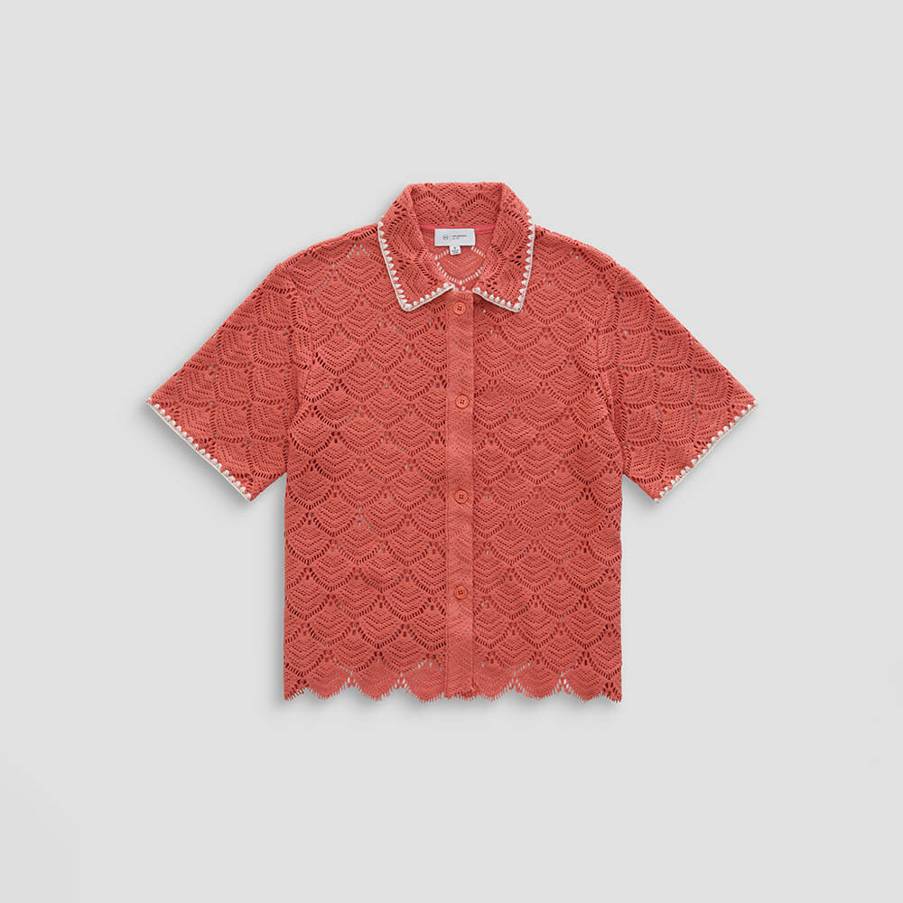 Red lace short-sleeve blouse on a light gray background