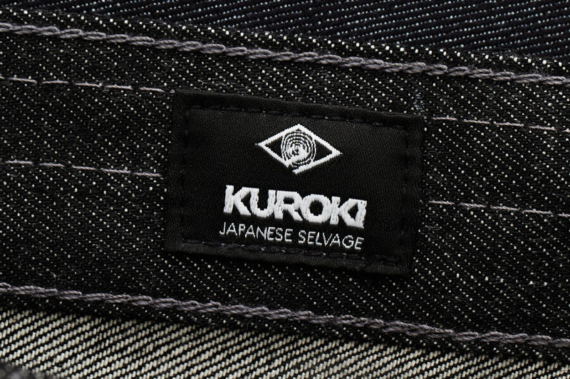Kuroki label on a denim fabric background