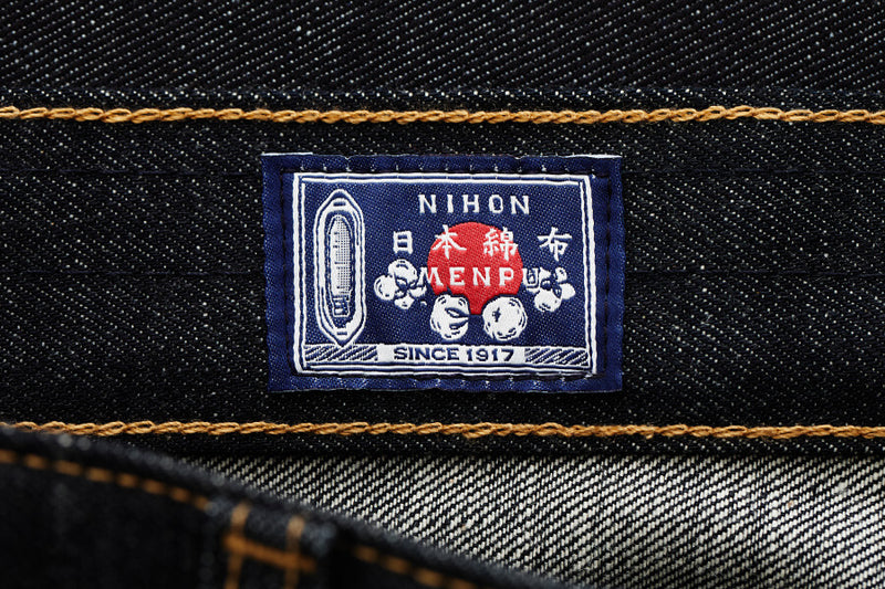 Nihon Menfuku label on denim fabric with gold stitching