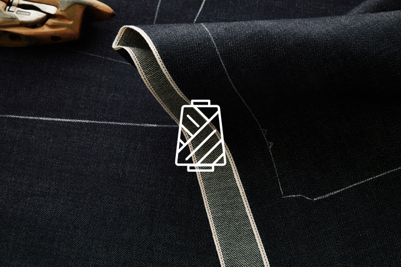 Craftmanship = A detailed shot of selvage fabric with pattern chalk and an icon overlay.