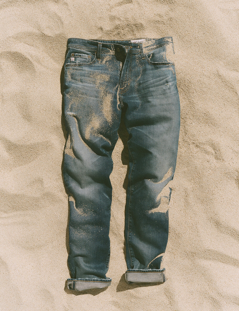 Jeans on sand