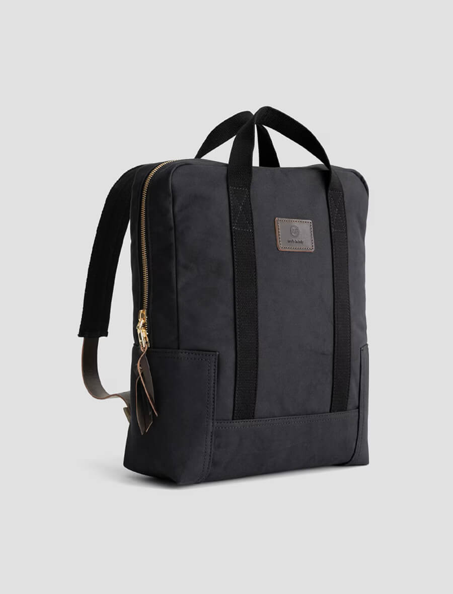 Black backpack with a visible brand logo on a light gray background