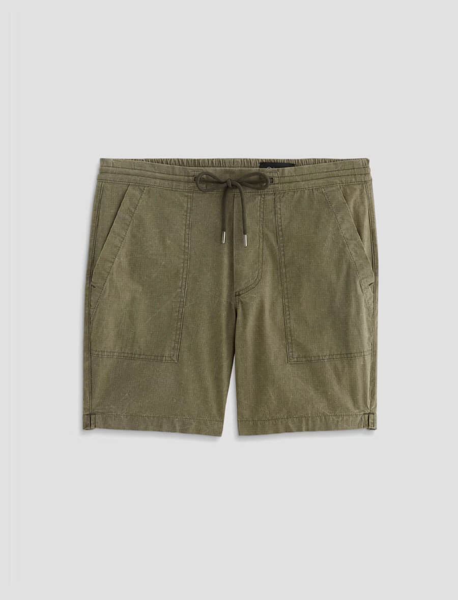 Green shorts with a drawstring on a light gray background