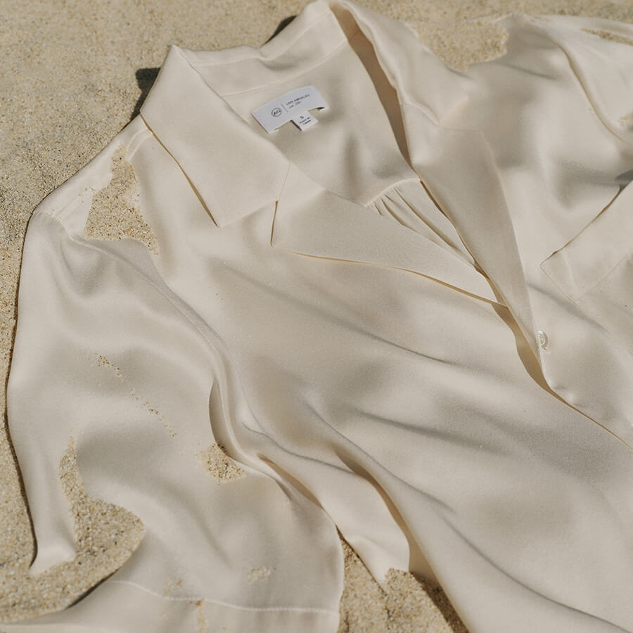 White silk shirt in sand