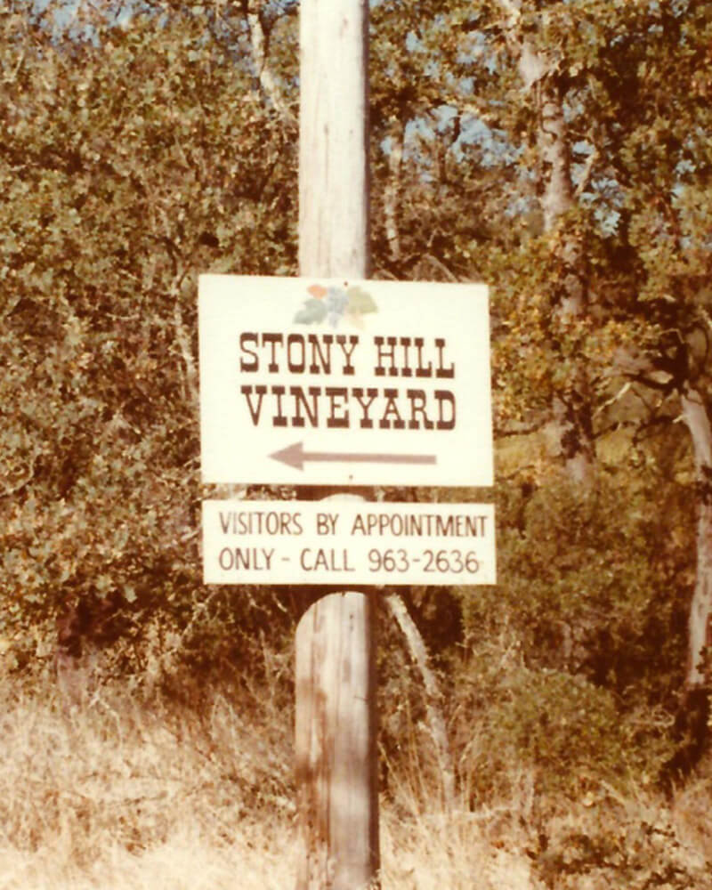 Sign for Stony Hill Vineyard surrounded by trees