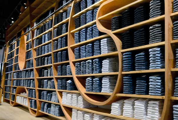 Rows Of Denim Jeans On Shelves In A Retail Store Stock Photo, Picture and  Royalty Free Image. Image 21996707.